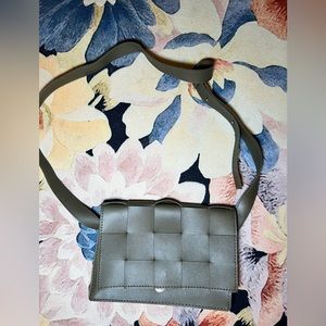 Green pleated crossbody bag with adjustable strap